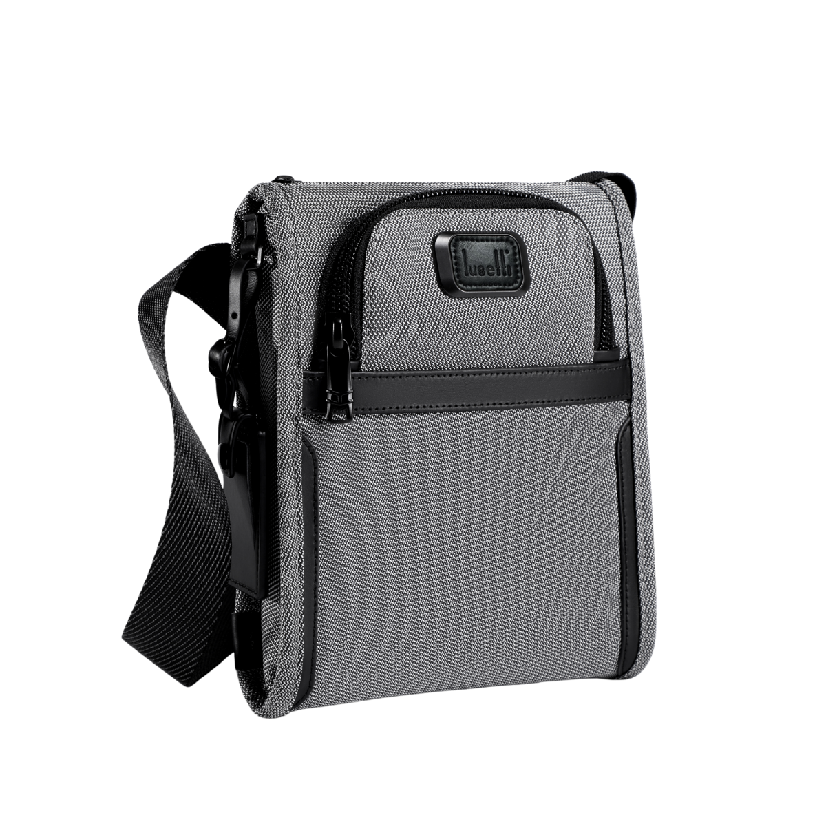 A gray and black crossbody utility bag with a textured fabric body, black zippers, and a black adjustable shoulder strap, shown on a plain white background.