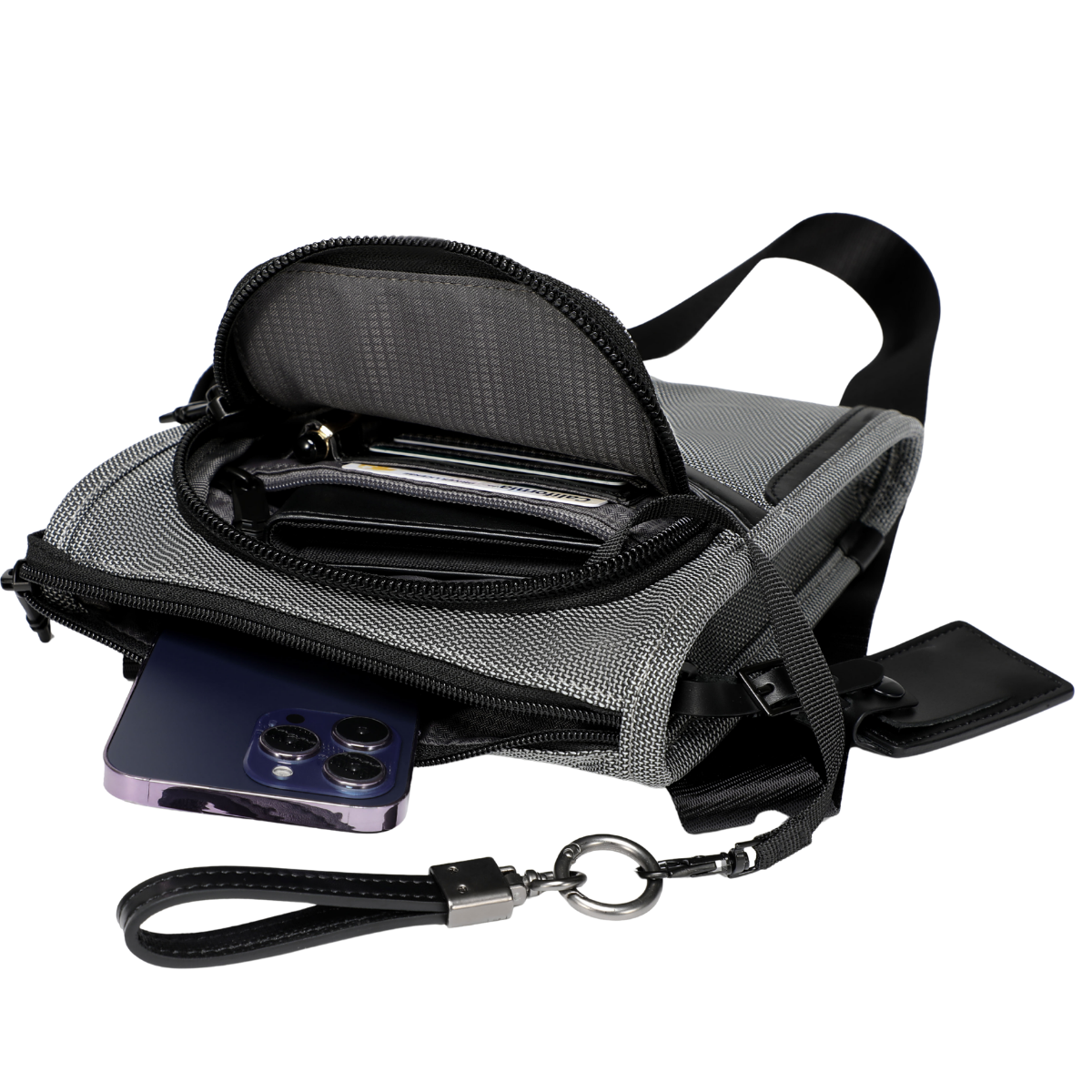 A gray and black mesh crossbody phone bag shown open, with a smartphone tucked inside and a wrist strap attached. The bag has multiple zip compartments, card slots, and a black strap on a plain white background.